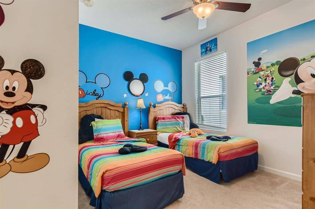 Mickey Mouse Themed Bedroom with Two Twin Beds at Memory Lane Villa in Windsor Hills Vacation Rental Home Community Orlando Florida