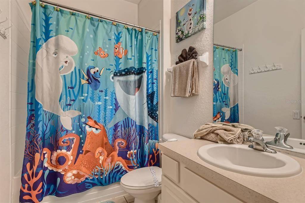 Nemo Shower Curtain Bathroom with Tub and Shower Combo at Memory Lane Villa in Windsor Hills Vacation Rental Home Community Orlando Florida